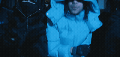 Man In Blue Hooded Jacket Sitting In Dark Room GIF