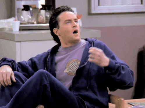 Man In Blue Hoodie And Purple Shirt With Planet GIF