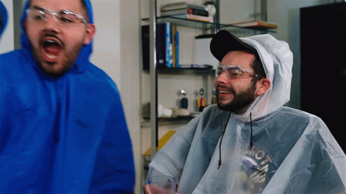 Man In Blue Hoodie And White Poncho With Moto GIF