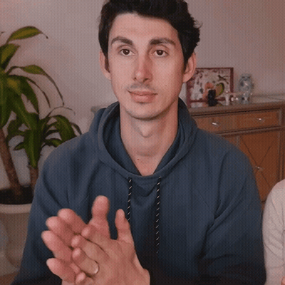 Man In Blue Hoodie Clapping With Plant GIF