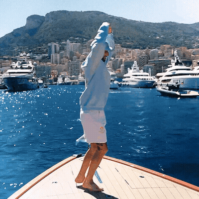 Man In Blue Hoodie On Boat In Ocean GIF