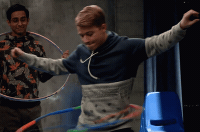 Man In Blue Hoodie Playing Hula Hoop GIF