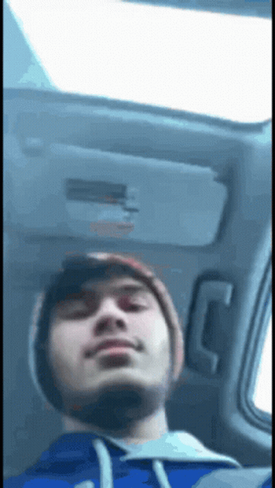 Man In Blue Hoodie Sitting In Back Seat GIF