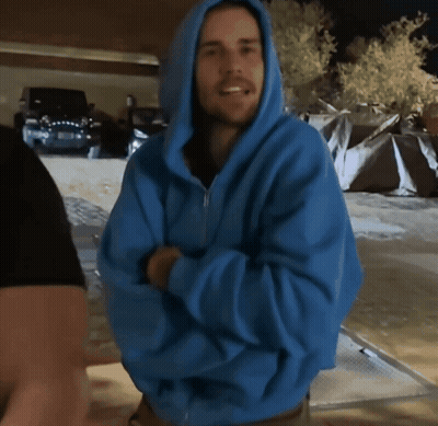 Man In Blue Hoodie Smiling With Arms Crossed GIF