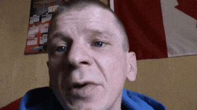Man In Blue Hoodie With Canadian Flag GIF