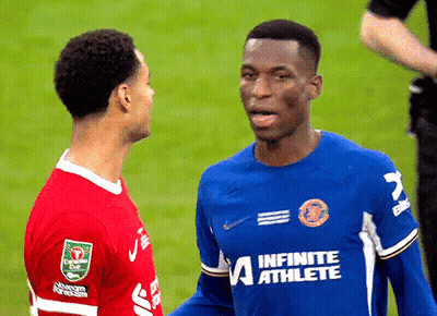 Man In Blue Infinite Athlete Jersey Talking To Another Man GIF