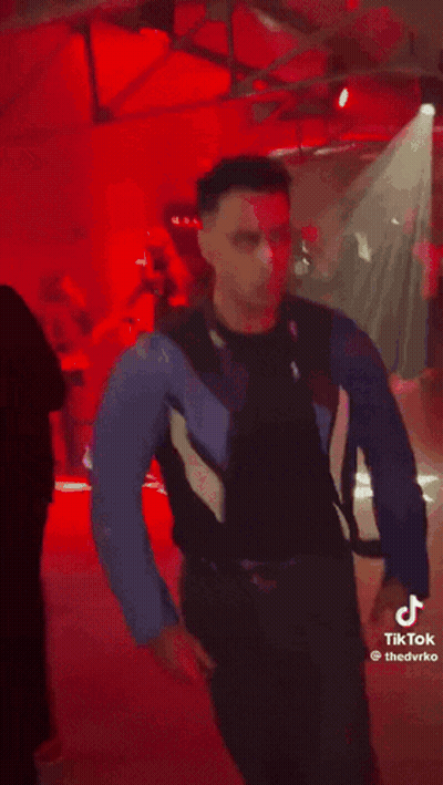 Man In Blue Jacket And Black Shirt GIF