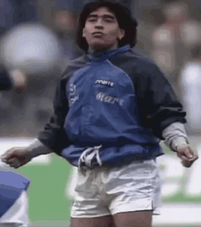 Man In Blue Jacket And Shorts On Soccer Field GIF