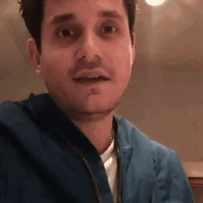 Man In Blue Jacket And White Shirt GIF