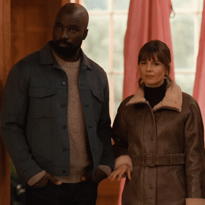 Man In Blue Jacket And Woman In Brown Coat GIF