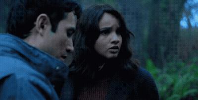 Man In Blue Jacket And Woman Looking On GIF