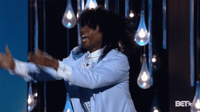 Man In Blue Jacket Dancing In Front Of BET Logo GIF