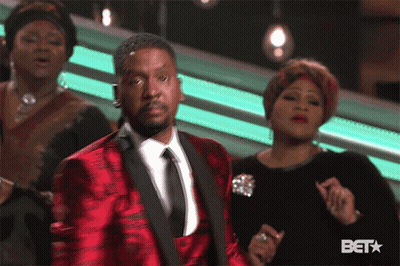 Man In Blue Jacket Dancing In Front Of BET Logo GIF