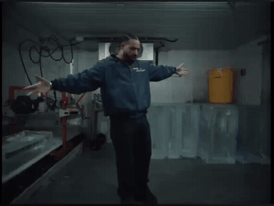 Man In Blue Jacket Dancing In Ice Room GIF