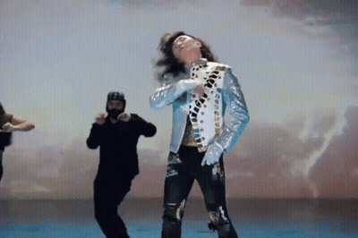 Man In Blue Jacket Dancing With Man In Black Jacket GIF