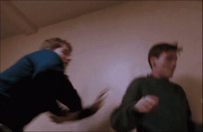 Man In Blue Jacket Fighting Another GIF
