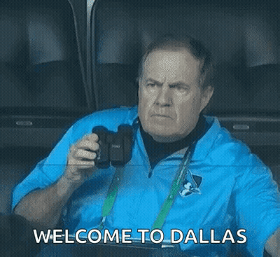 Man In Blue Jacket Holding Camera Saying Welcome To Dallas GIF