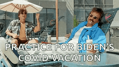 Man In Blue Jacket Holding Drink GIF