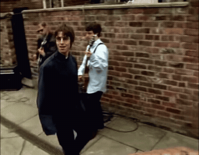 Man In Blue Jacket Holding Guitar GIF