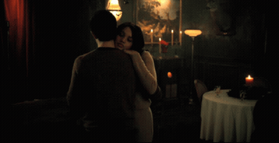 Man In Blue Jacket Holding Something Woman Looking On GIF