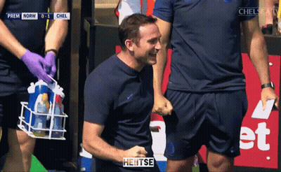 Man In Blue Jacket In Front Of Crowd Saying Heitse GIF