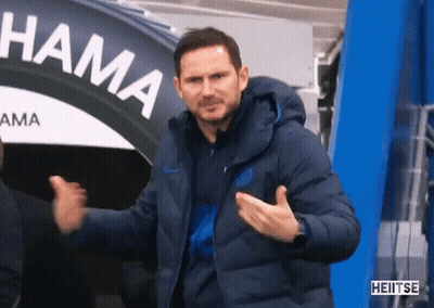 Man In Blue Jacket In Front Of Hama Sign GIF