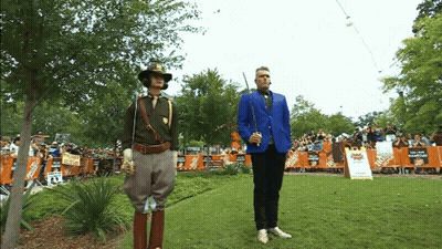 Man In Blue Jacket In Front Of Home Depot Sign GIF