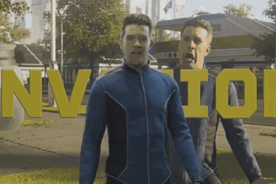 Man in Blue Jacket in Front of Nvidia Sign