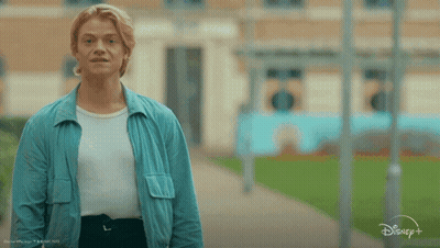 Man In Blue Jacket In Front Of Sign Saying I Kn GIF