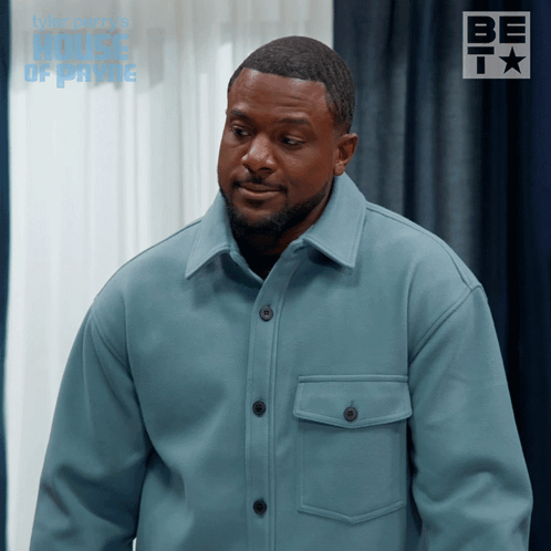 Man In Blue Jacket In Front Of Window With House Of Payne GIF