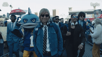 Man In Blue Jacket Number 02 In Front Of Crowd GIF