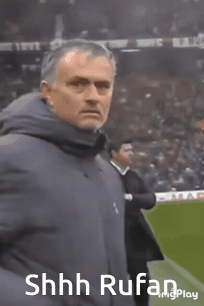 Man In Blue Jacket On Soccer Field With Shhh Rufan GIF