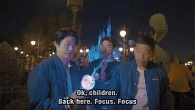 Man in Blue Jacket Says Ok Children Back Here Focus Focus in Front of Castle