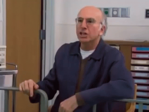 Man In Blue Jacket Sitting In Wheelchair GIF