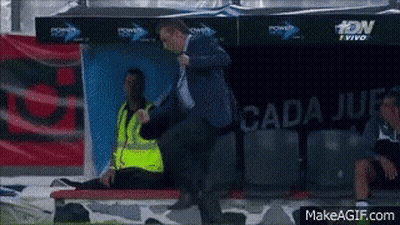 Man In Blue Jacket Standing Before Cada Jue Sign GIF