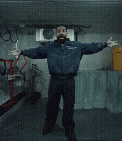 Man In Blue Jacket Standing With Yellow Bucket GIF