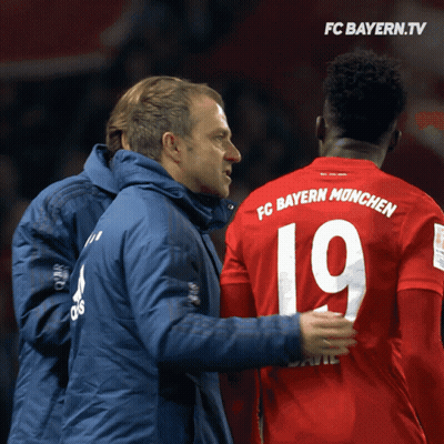 Man In Blue Jacket Talking To Man In Red Jersey 19 GIF