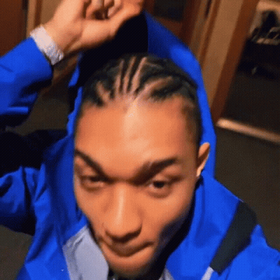 Man In Blue Jacket With Braids GIF
