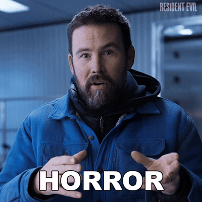 Man In Blue Jacket With Horror Written On Face GIF