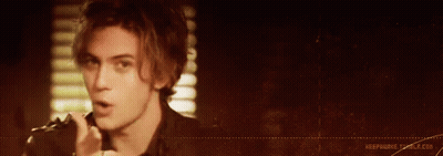 Man In Blue Jacket With Question Mark On Shirt GIF