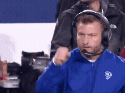 Man In Blue Jacket With Ram And Headphones GIF