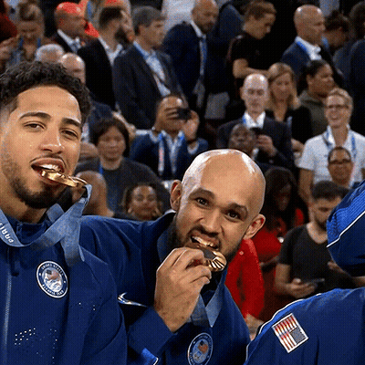 Man In Blue Jacket With USA Medal GIF