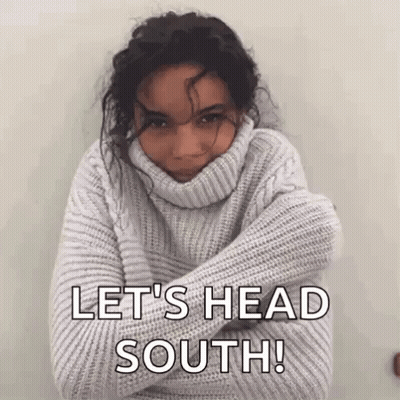 Man In Blue Jacket With White Collar Looking Down GIF