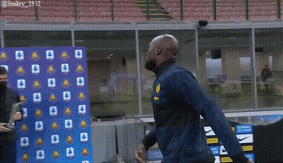 Man In Blue Jacket With Yellow Smiley GIF