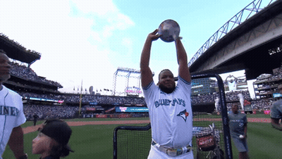 Man In Blue Jays Jersey Holding Trophy Up GIF
