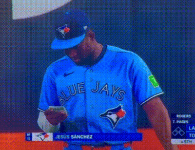 Man In Blue Jays Jersey Looking At Phone GIF