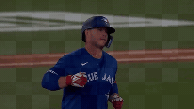 Man In Blue Jays Jersey Standing On Field GIF