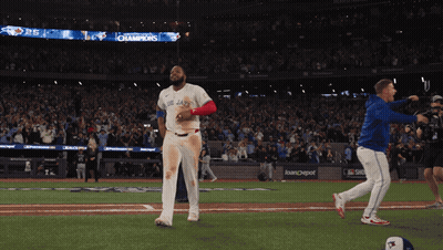 Man In Blue Jays Uniform Walking GIF