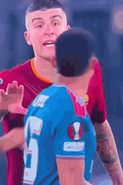 Man In Blue Jersey Hugging Man In Red Shirt GIF