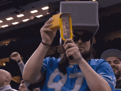 Man In Blue Jersey Number 40 Grating Cheese GIF